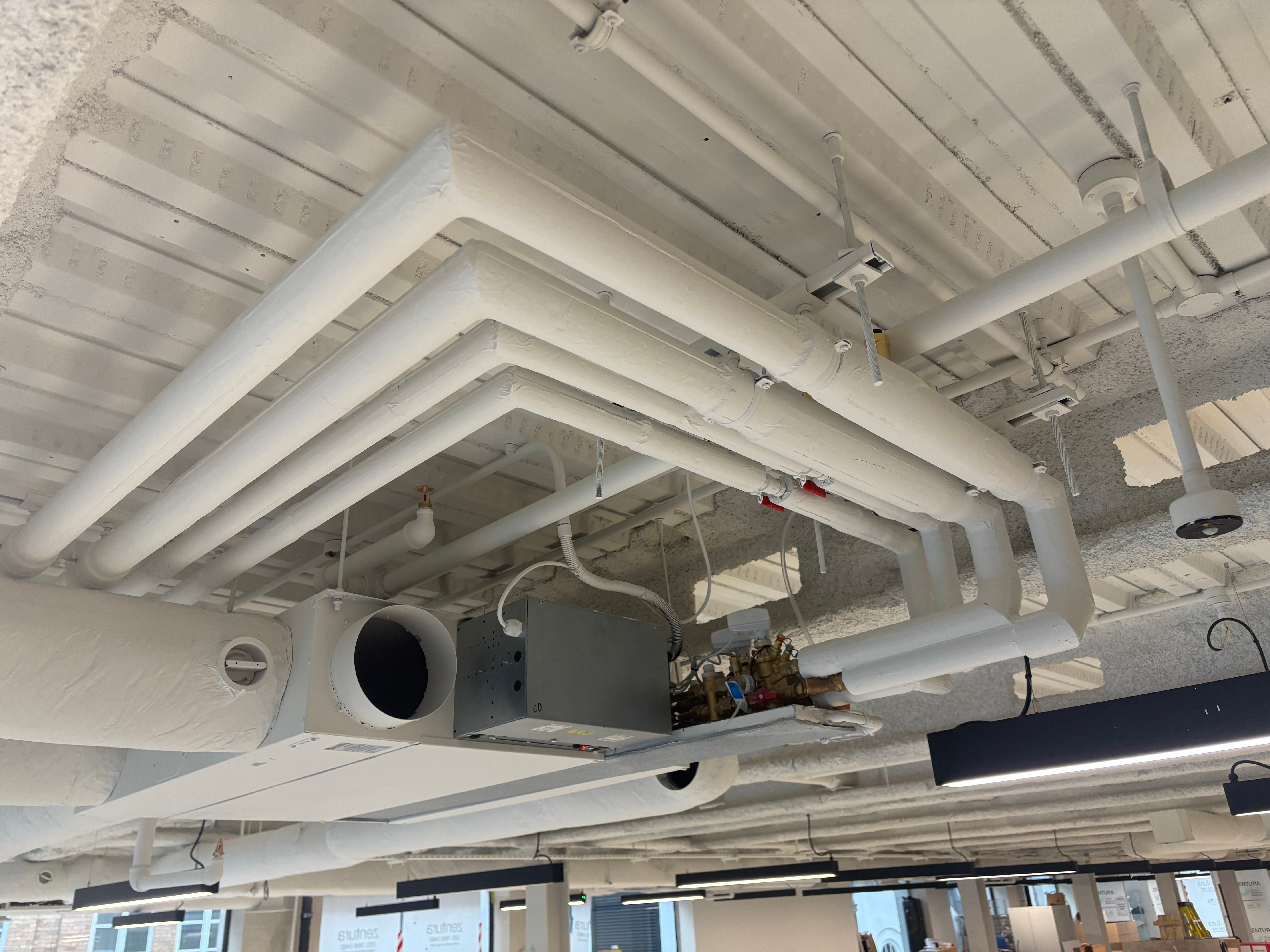 Finished white pipework and HVAC installation